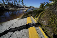 CORRECTS DATELINE TO MATLACHA, FLA., INSTEAD OF SPRING HILL - The destroyed bridge leading to Pine Island is seen in the aftermath of Hurricane Ian in Matlacha, Fla., Sunday, Oct. 2, 2022. The only bridge to the island is heavily damaged so it can only be reached by boat or air. (AP Photo/Gerald Herbert)