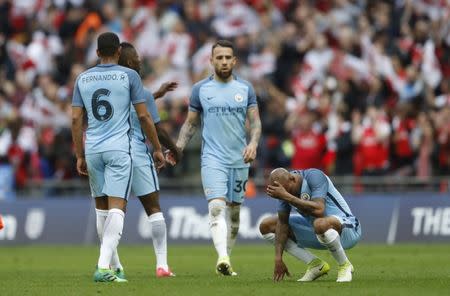 Britain Football Soccer - Arsenal v Manchester City - FA Cup Semi Final - Wembley Stadium - 23/4/17 Manchester City's Fabian Delph and team mates look dejected after the match Action Images via Reuters / Carl Recine Livepic