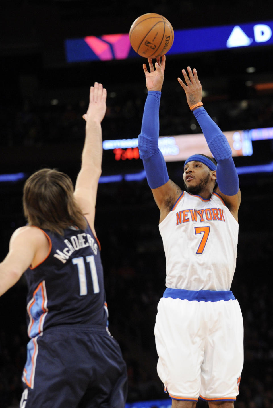 New York Knicks' Carmelo Anthony, right, shoots over Charlotte Bobcats' Josh McRoberts during the first quarter of an NBA basketball game, Friday, Jan. 24, 2014, at Madison Square Garden in New York. (AP Photo/Bill Kostroun)