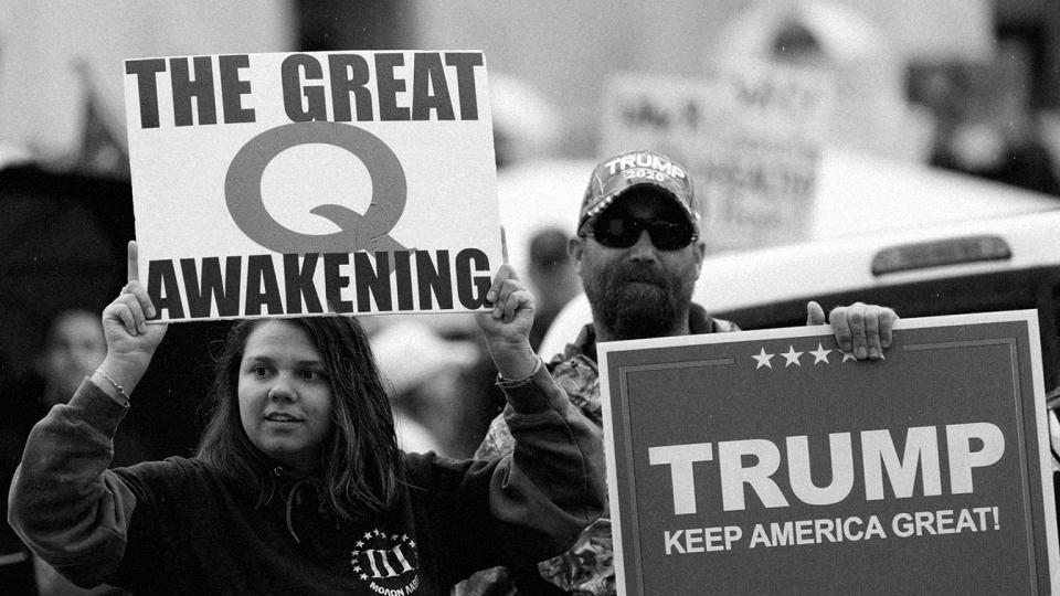 The Q-Anon conspiracy theorists  hold signs during the protest at the State Capitol in Salem, Oregon in May. (John Rudoff/Anadolu Agency via Getty Images)