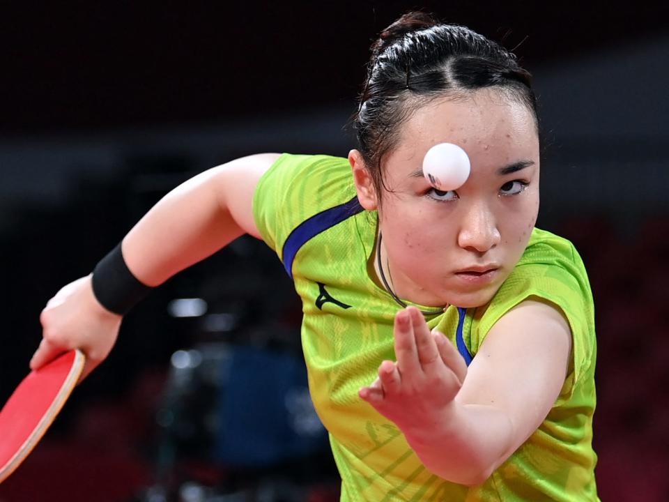 Japan's Mima Ito looks at the bar while serving in ping pong