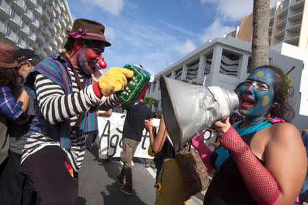 People protesting against first seminar of the Puerto Rico Oversight, Management and Economic Stability Act (PROMESA), chant slogans as they try to prevent participants from entering the hotel which is scheduled to be the venue of the seminar, in San Juan, August 31, 2016. REUTERS/Ana Martinez