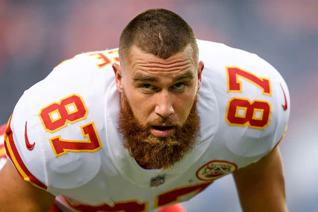 <p> Dustin Bradford/Getty</p> Tight end Travis Kelce #87 of the Kansas City Chiefs stretches on the field before a game