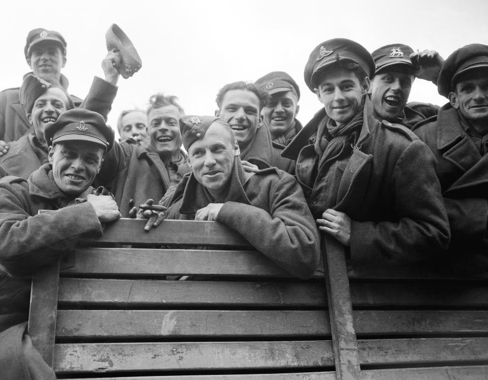 FILE - British prisoners liberated by General Paton's Fourth Armored Division in the vicinity of Gotha, Germany on April 8, 1945. Some of them were taken prisoner at Dunkirk. (AP Photo/Byron Rollins, File)
