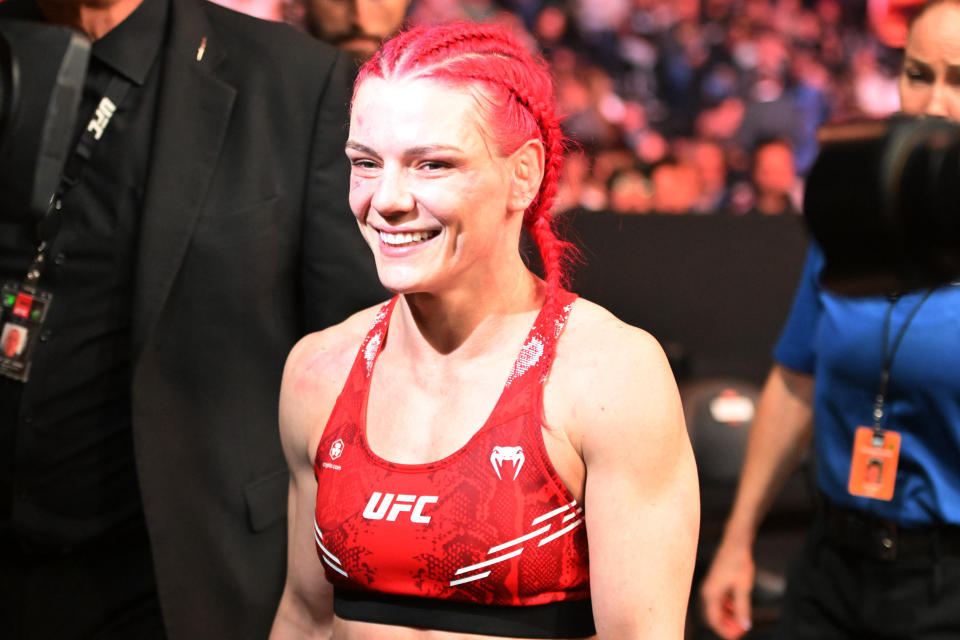 Jan 20, 2024; Toronto, Canada, USA; Gillian Robertson (red glove) celebrates defeating Polyana Viana (blue gloves) during UFC 297 at ScotiaBank Arena. Mandatory Credit: Dan Hamilton-USA TODAY Sports