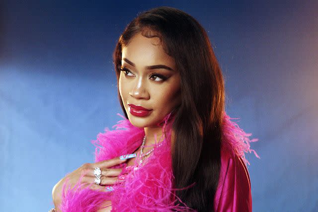 <p>Courtesy of Postmates</p> Saweetie for The Hot Mess x The Boiling Crab x Postmates Partnership