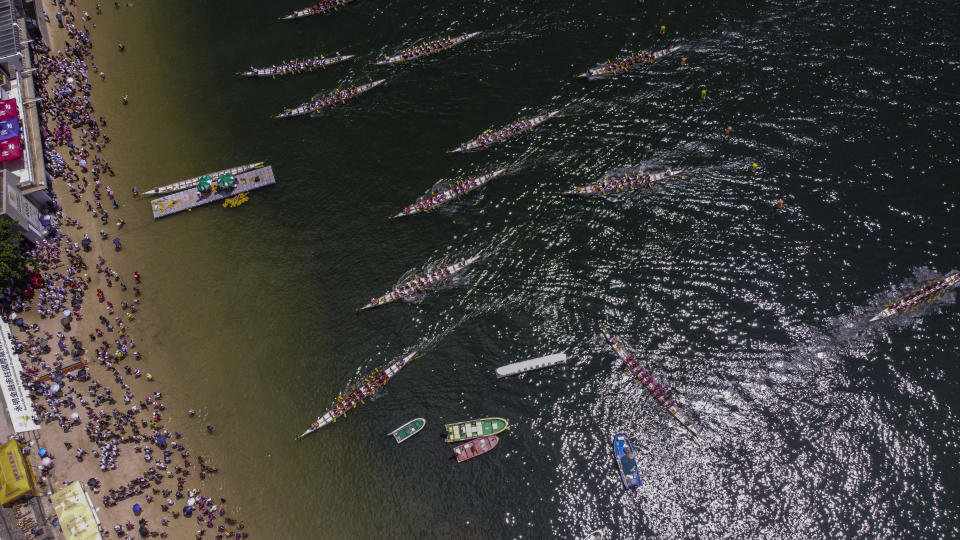 Competitors take part in the annual dragon boat race to celebrate the Tuen Ng festival in Hong Kong, Thursday, June 22, 2023. (AP Photo/Louise Delmotte)