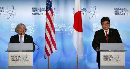 U.S. Secretary of Energy Ernest Moniz (L) and Japan's Deputy Chief Cabinet Secretary Koichi Hagiuda (R) hold a joint press statement at the Nuclear Security Summit in Washington April 1, 2016. REUTERS/Gary Cameron
