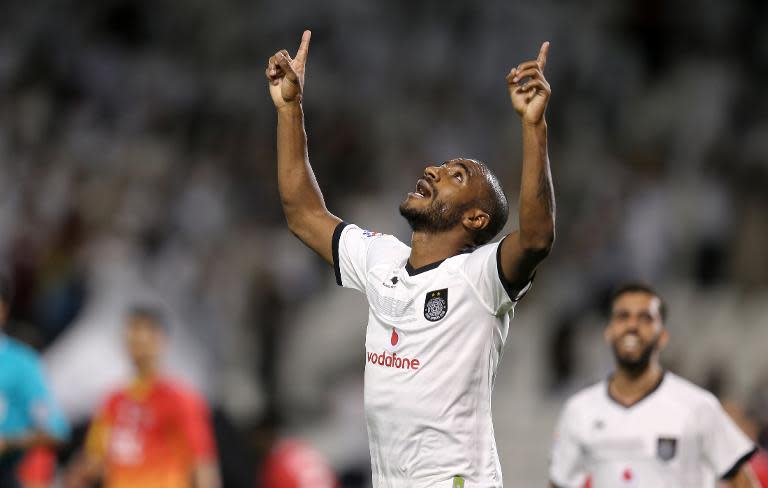 Al-Sadd's Muriqui celebrates after scoring during their AFC champions league football match against Iran's Foolad Khuzestan on April 21, 2015 in Doha