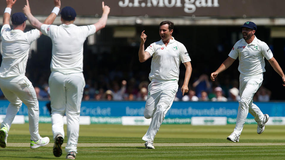 Tim Murtagh celebrates one of his five wickets against England. (Photo by IAN KINGTON/AFP/Getty Images)