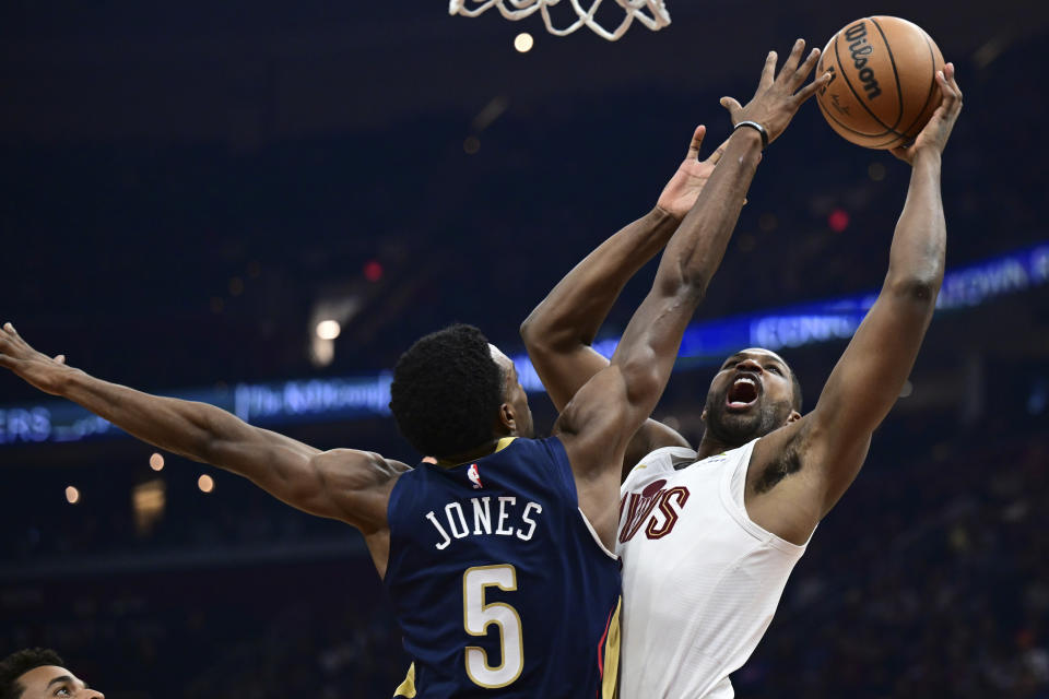 Cleveland Cavaliers center Tristan Thompson shoots against New Orleans Pelicans forward Herbert Jones during the first half of an NBA basketball game Thursday, Dec. 21, 2023, in Cleveland. (AP Photo/David Dermer)