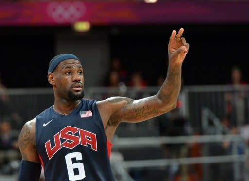 LeBron James seized command and enabled the United States to defeat Lithuania 99-94 and clinch a berth in the medal playoffs at the Olympic men's basketball tournament in London