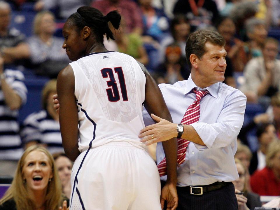 Tina Charles (left) and Geno Auriemma.