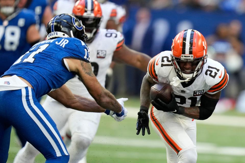 Cleveland Browns cornerback Denzel Ward (21) intercepts a pass intended for Indianapolis Colts wide receiver Michael Pittman Jr. (11) on Oct. 22 in Indianapolis.