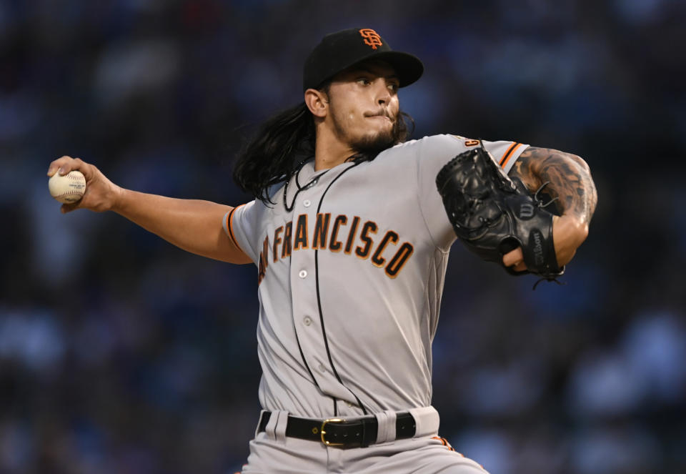 San Francisco Giants starter Dereck Rodriguez delivers a pitch during the first inning of the team's baseball game against the Chicago Cubs on Wednesday, Aug 21, 2019, in Chicago. (AP Photo/Paul Beaty)