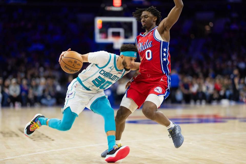 Charlotte Hornets guard Seth Curry (30) dribbles the ball against Philadelphia 76ers guard Tyrese Maxey (0) during the third quarter at Wells Fargo Center.