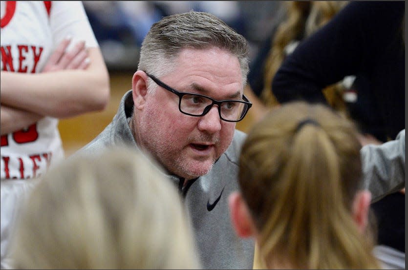 Caney Valley head girls basketball coach Deric Longan instructs his girls during a break on Feb. 13, 2023.