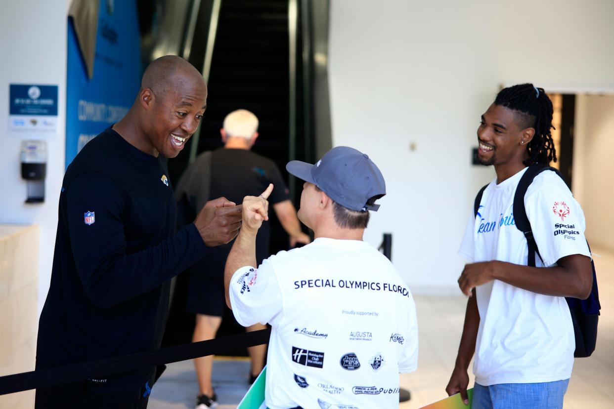 Quality control coach for the Jacksonville Jaguars Henry Burris talks with athletes Friday, June 3, 2022 at TIAA Bank Field in Jacksonville. A group of Special Olympic athletes received a formal sendoff and will compete June 6-11 in Orlando. [Corey Perrine/Florida Times-Union]