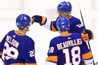 New York Islanders center Brock Nelson (29) celebrates his goal with teammates Anthony Beauvillier (18) and Josh Bailey (12) during the second period of an NHL Stanley Cup Eastern Conference playoff hockey game, Sunday, Aug. 30, 2020 in Toronto. (Frank Gunn/The Canadian Press via AP)