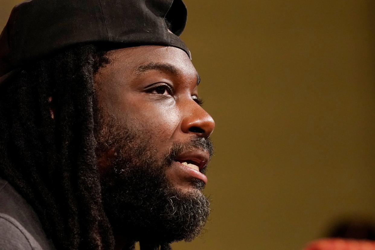 Author Jason Reynolds speaks at the Mississippi Book Festival in Jackson, Miss. Aug. 19, 2023. Reynolds has said "I write to Black children. But I write for all children." The philosophy resonates with Black Tea Bookshop's Candace Hulsizer.