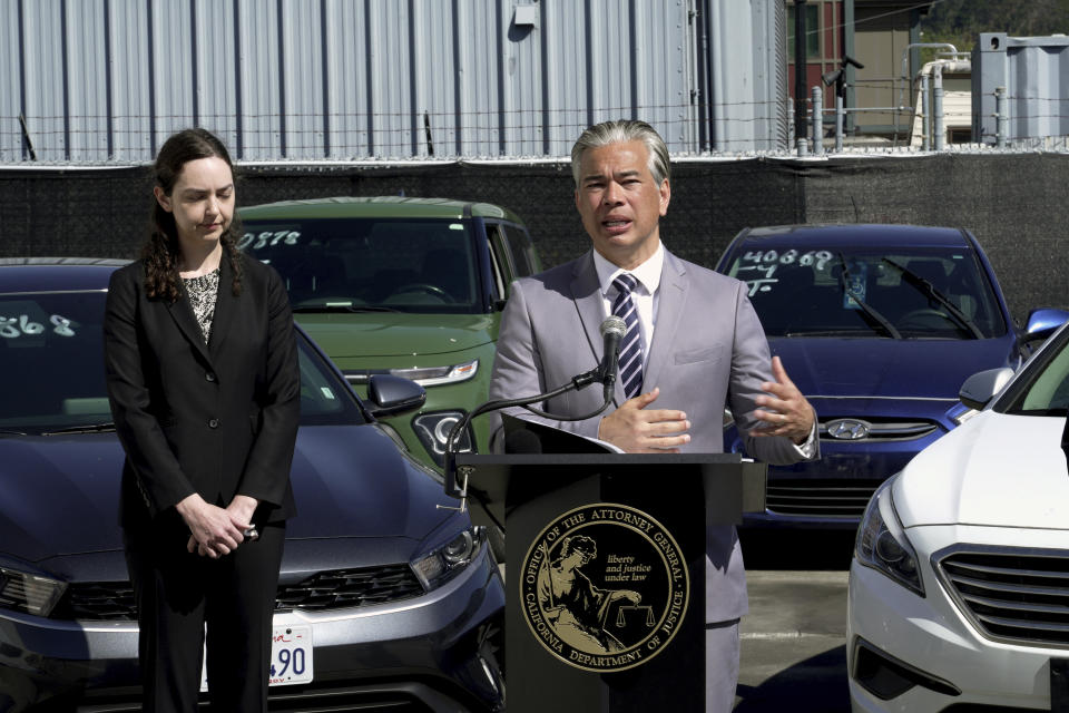 California Attorney General Rob Bonta, right, joined by Deputy Attorney General Holly Mariella, left, speaks during a news conference Thursday, April 20, 2023, in Berkeley, Calif., about the surge in thefts of KIA and Hyundai vehicles. Attorneys general in 17 states plus Washington, DC, on Thursday urged the federal government to recall millions of Kia and Hyundai cars because they are too easy to steal; a response to a sharp increase in thefts fueled by a viral social media challenge. (AP Photo/Terry Chea)