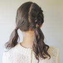 <p>With the untied section of hair, Dutch braid it from the root to the nape of your neck and secure in place with a hair tie. </p>