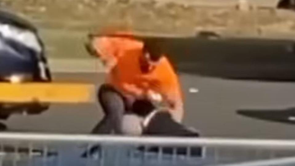 A brutal road rage attack has been caught on camera showing a driver repeatedly kicking and punching a man in the middle of traffic at Dundas last Friday. Picture: 7 News