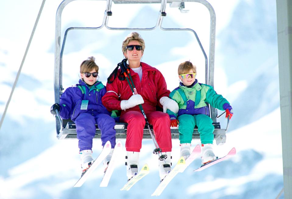 Princess Diana took her sons skiing from a young age. Here she is with Prince William and Prince Harry in some bright outfits as they take to the mountain in 1991.