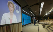 European Council President Charles Michel, on podium right, and European Commission President Ursula von der Leyen, on screen left, address journalists during a media conference following an EU summit in video conference format at the European Council building in Brussels, Wednesday, Aug. 19, 2020. European Union leaders on Wednesday said they stand beside people in Belarus protesting for their democratic rights, underlining that the EU rejects the election results that swept President Alexander Lukashenko back into power and is preparing a list of several people that face sanctions over vote fraud and the crackdown that followed. (Olivier Hoslet, Pool Photo via AP)