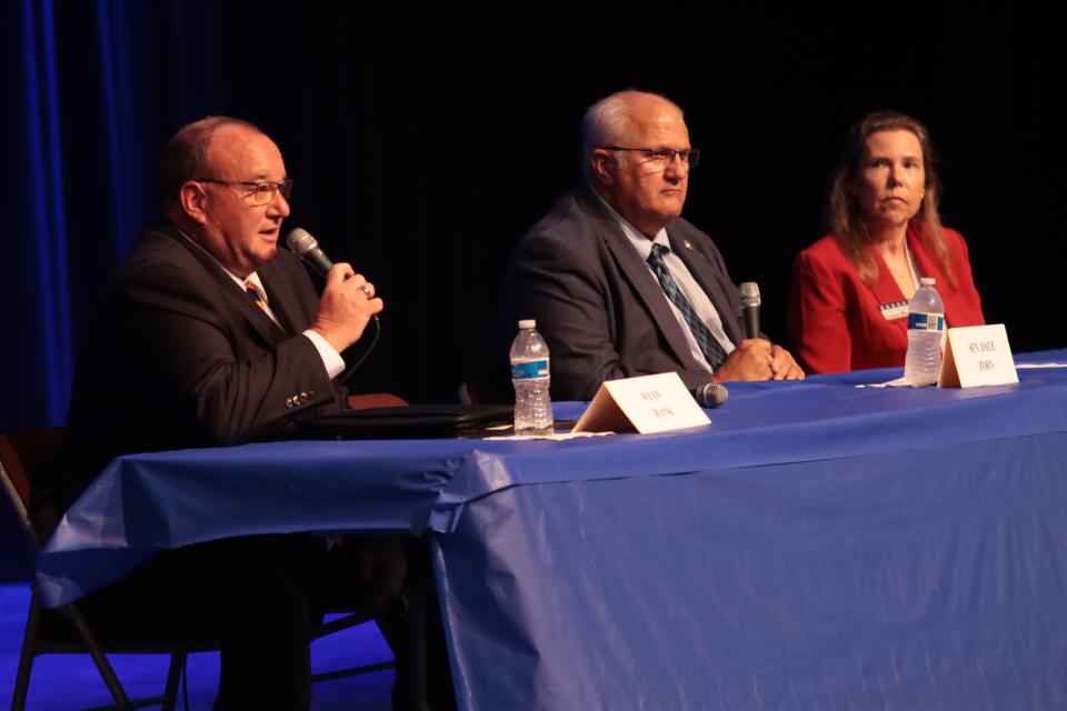 Ryan Rank of Madison Township, left, answers a question while state Sen. Dale Zorn of Onsted and Julie Moore of Adrian Township listen Thursday during a candidate forum at Adrian High School. The three are seeking the Republican nomination in the 34th Michigan House District.