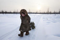 A girl collects wood from a forest in Siberia, Russia. Alessandra Meniconzi from Switzerland was the winner of the New Talent award (Travel Photographer of the Year)