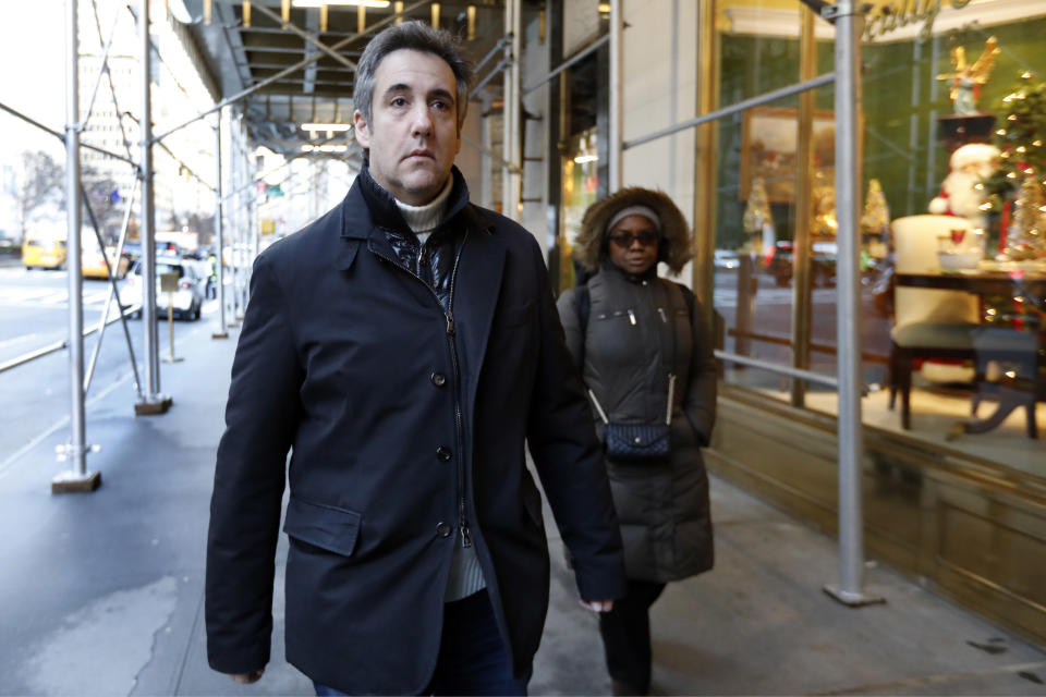 Michael Cohen, former lawyer to President Donald Trump, leaves his apartment building on New York's Park Avenue, Friday, Dec. 7, 2018. In the latest filings Friday, prosecutors will weigh in on whether Cohen deserves prison time and, if so, how much. (AP Photo/Richard Drew)