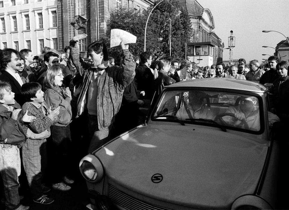 West Berlin citizens welcome East Germans who passed the border checkpoint Invaliden Strasse with an East German Trabant car after the opening of the East German border was announced in this  Nov. 9, 1989. (Photo: Fabrizio Bensch/Reuters)