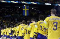 Ice Hockey - 2018 IIHF World Championships - Semifinals - Sweden v USA - Royal Arena - Copenhagen, Denmark - May 19, 2018 - Team Sweden listen to the national anthem after winning a match. REUTERS/Grigory Dukor