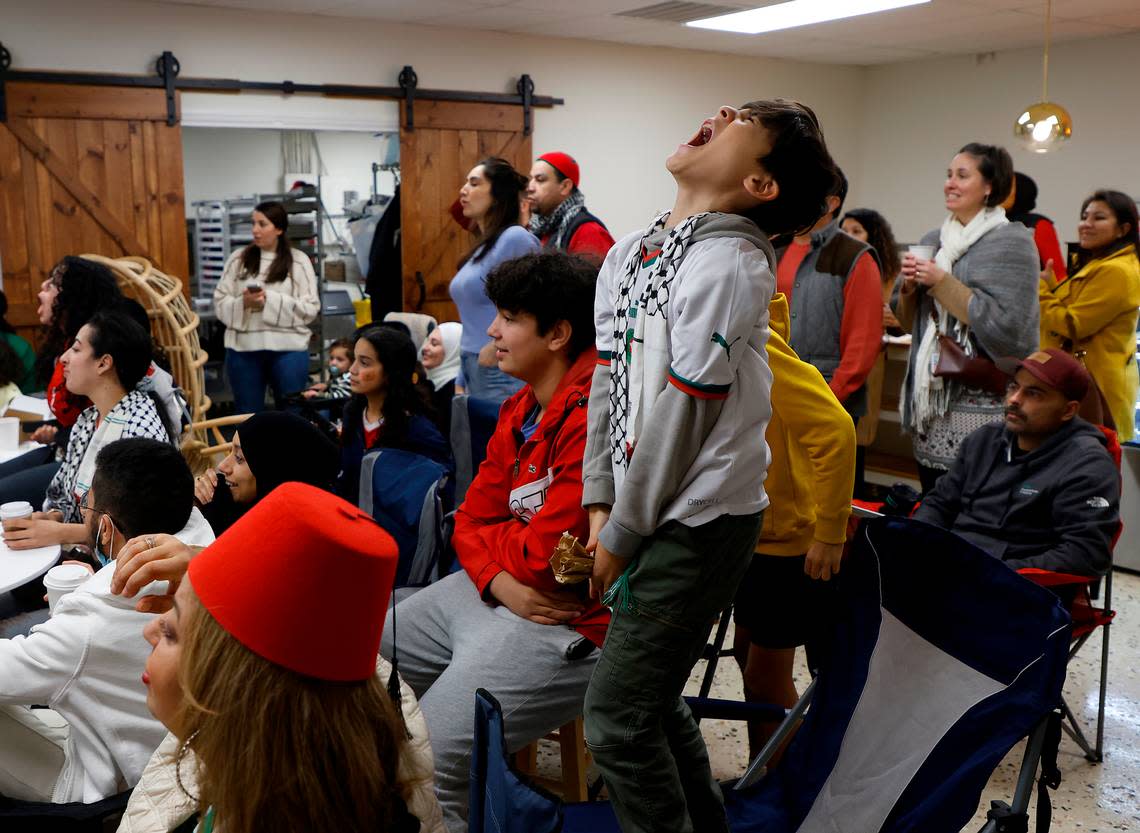 Fans react while watching the second half of the World Cup semifinal match between Morocco and France at La Recette patisserie in Durham, N.C. on Wednesday, Dec. 14, 2022.