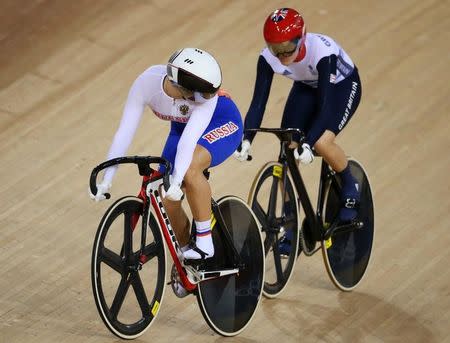 FILE PHOTO - Britain's Victoria Pendleton (R) and Russia's Ekaterina Gnidenko compete during the track cycling women's sprint 1/16 finals at the Velodrome during the London 2012 Olympic Games August 5, 2012. REUTERS/Stefano Rellandini