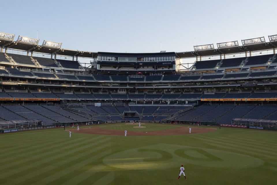 The stands are empty during an exhibition baseball game between the Washington Nationals and the Philadelphia Phillies at Nationals Park, Saturday, July 18, 2020, in Washington. (AP Photo/Alex Brandon)