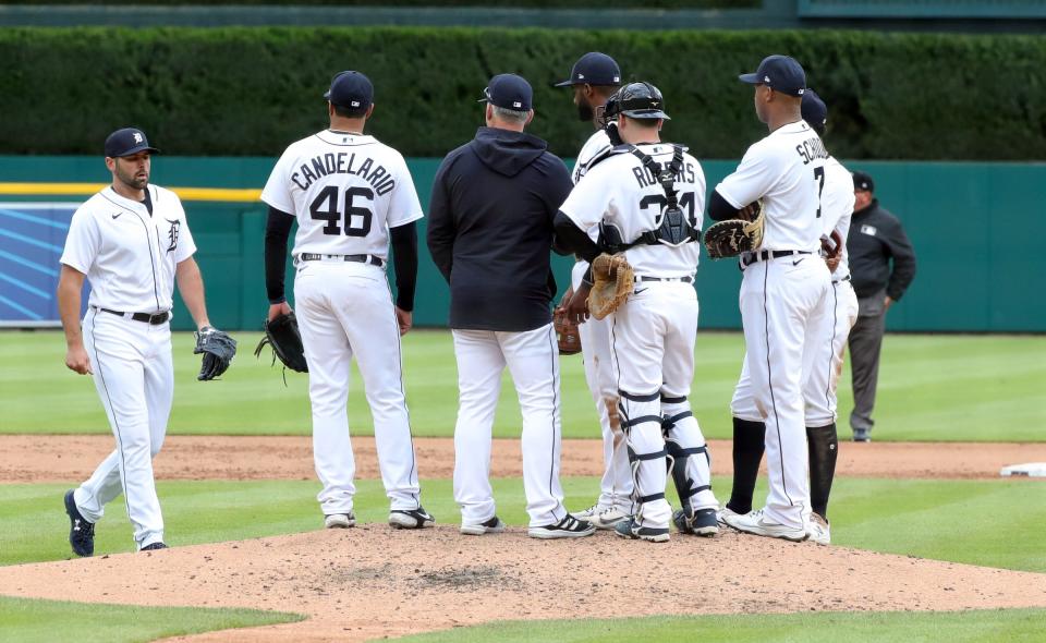 Detroit Tigers manager A.J. Hinch (14) brings in reliever Michael Fulmer (32) during fifth inning action against the Minnesota Twins Saturday, May 8, 2021 at Comerica Park in Detroit.