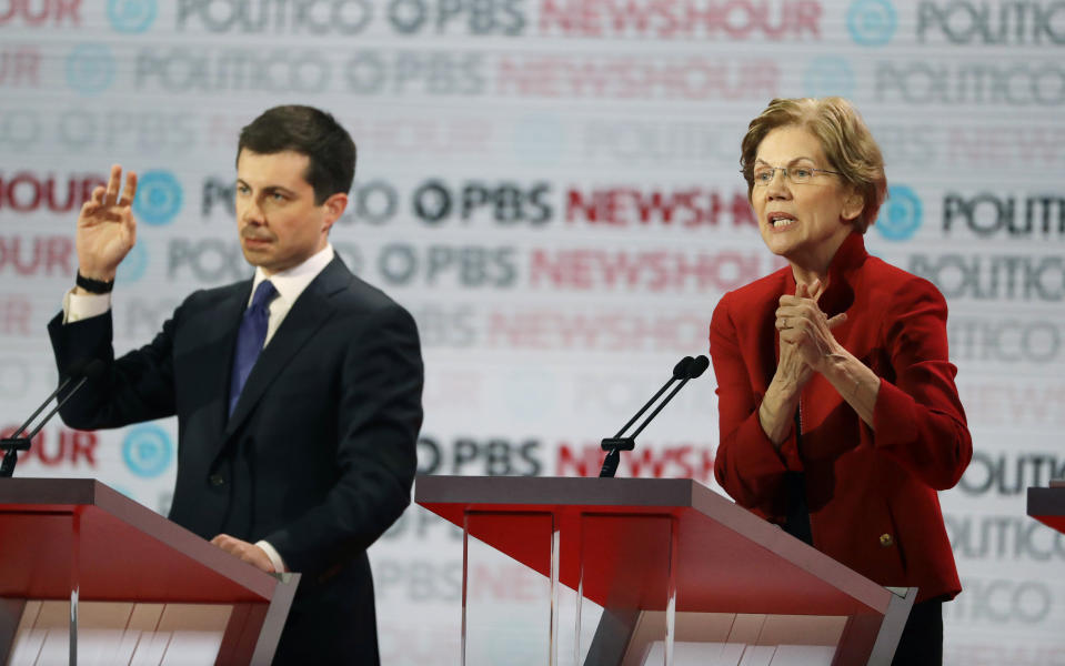 Democratic presidential candidate Sen. Elizabeth Warren, D-Mass., right, speaks beside South Bend Mayor Pete Buttigieg during a Democratic presidential primary debate Thursday, Dec. 19, 2019, in Los Angeles. (AP Photo/Chris Carlson)