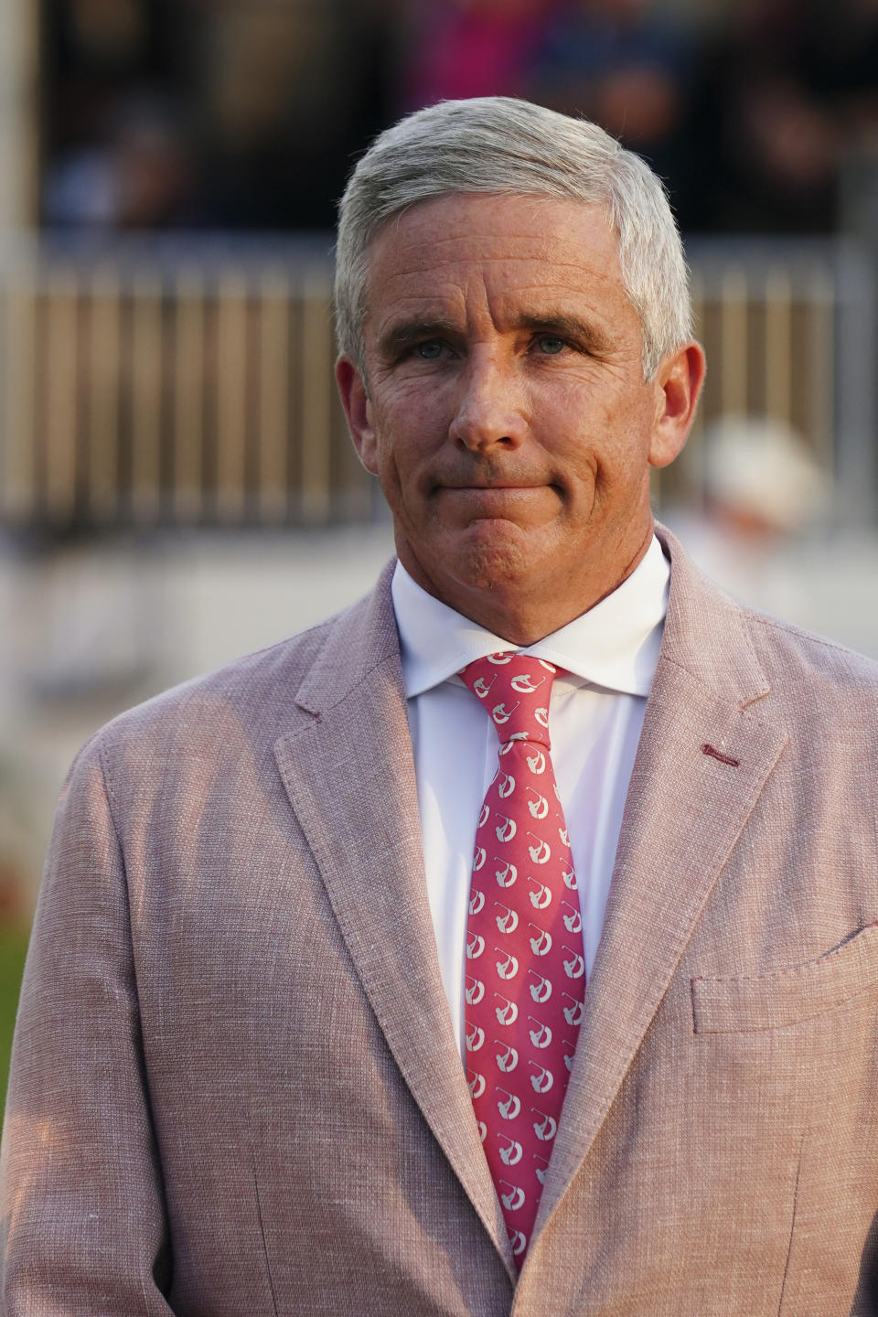 FILE - PGA Tour Commissioner Jay Monahan stands on the 18th green after Viktor Hovland, of Norway, won the Tour Championship golf tournament, Sunday, Aug. 27, 2023, in Atlanta. Monahan says the tour has a program that would allow players to have equity ownership of the commercial enterprise. (AP Photo/John Bazemore, File)