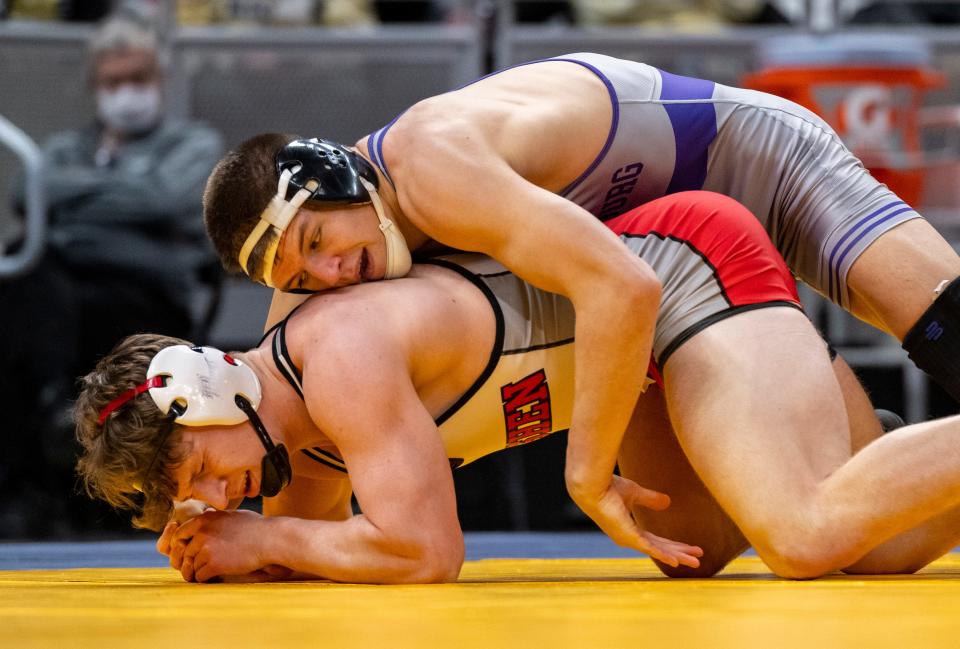 Brownsburg High School sophomore Caden Brewer, right, wrestles in a 182-pound match against Goshen High School junior Laish Detwiler during a quarter-final round of the IHSAA Wrestling State Championship, Friday, Feb. 17, 2023, at Gainbridge Fieldhouse in Indianapolis.