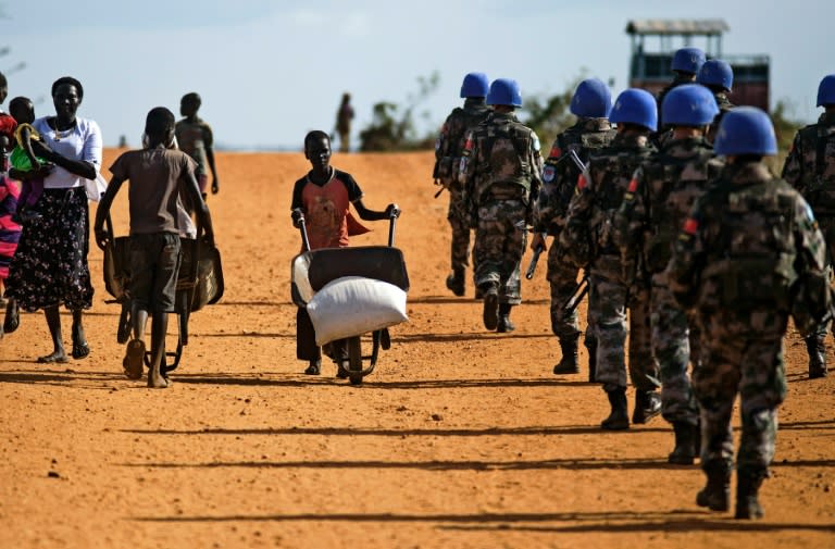 Peacekeeper troops deployed by the United Nations Mission in South Sudan (UNMISS), patrol on foot outside the premises of the UN Protection of Civilians (PoC) site in Juba, South Sudan, on October 4, 2016