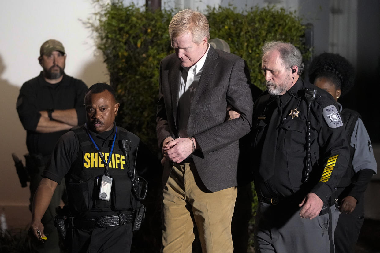 Alex Murdaugh is led outside the Colleton County Courthouse by sheriff's deputies after being convicted of two counts of murder Thursday in Walterboro, S.C., in the June 7, 2021, shooting deaths of Murdaugh's wife and son. 