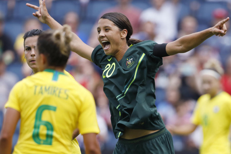 FILE - In this July 26, 2018, file photo, Australia's Sam Kerr, right, celebrates after her team scores against Brazil in the first half of a Tournament of Nations soccer match in Kansas City, Kan. USA. Kerr has been named captain of the women's national soccer, Wednesday, Feb. 27, 2019, as they prepared for Thursday's first match against New Zealand in the four-team Cup of Nations tournament. (AP Photo/Colin E. Braley, File)