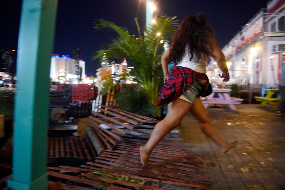 <p>A person runs from the Route 91 Harvest country music festival after apparent gun fire was heard on Oct. 1, 2017 in Las Vegas, Nevada. (Photo: David Becker/Getty Images) </p>