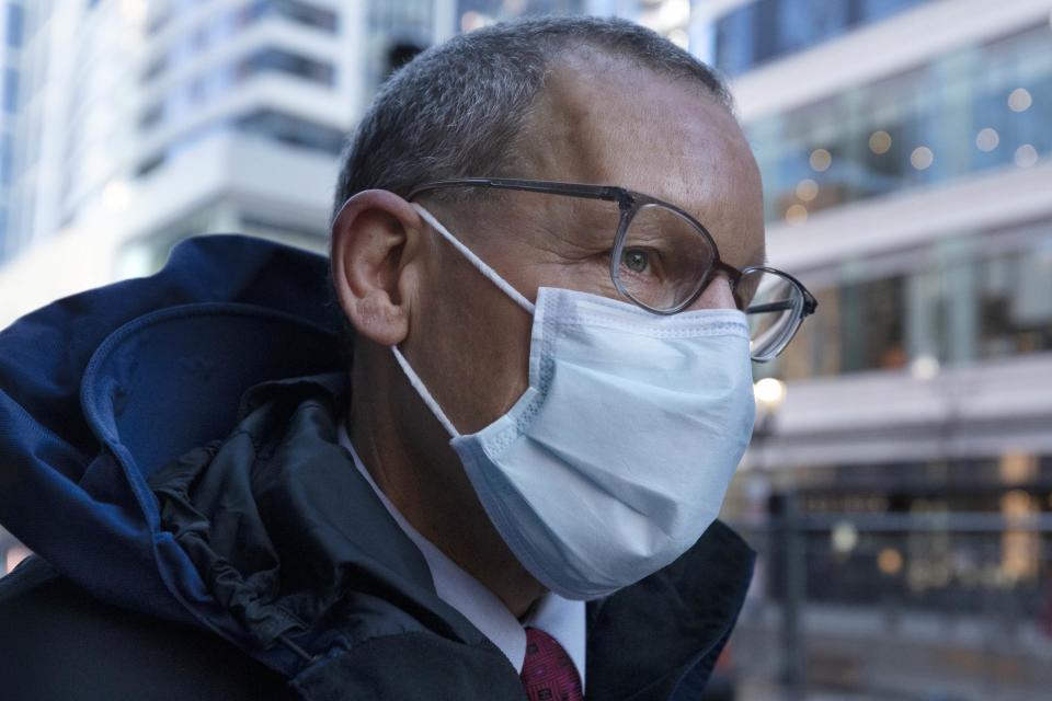 Harvard University professor Charles Lieber leaves federal court, Tuesday, Dec. 14, 2021, in Boston. Lieber is charged with hiding his ties to a Chinese-run recruitment program. His trial is the latest bellwether in the U.S. Justice Department's controversial effort to crackdown on economic espionage by China. (AP Photo/Michael Dwyer)