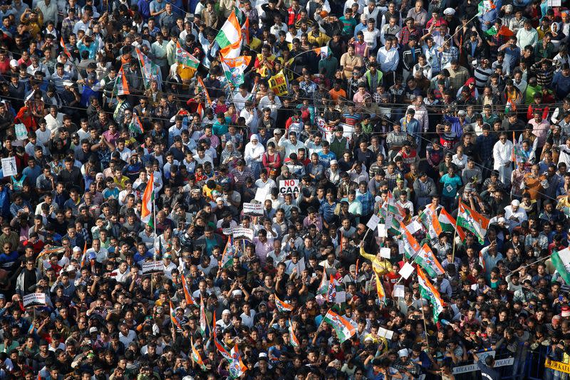 Supporters of Mamata Banerjee, the Chief Minister of West Bengal, attend a protest march against the National Register of Citizens and a new citizenship law, in Kolkata