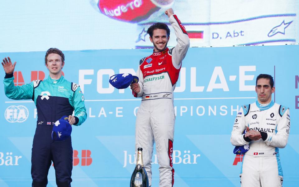 Daniel Abt (C) wins the Mexico EPrix ahead of Oliver Turvey (L) and Sebastian Buemi (R) - Formula E