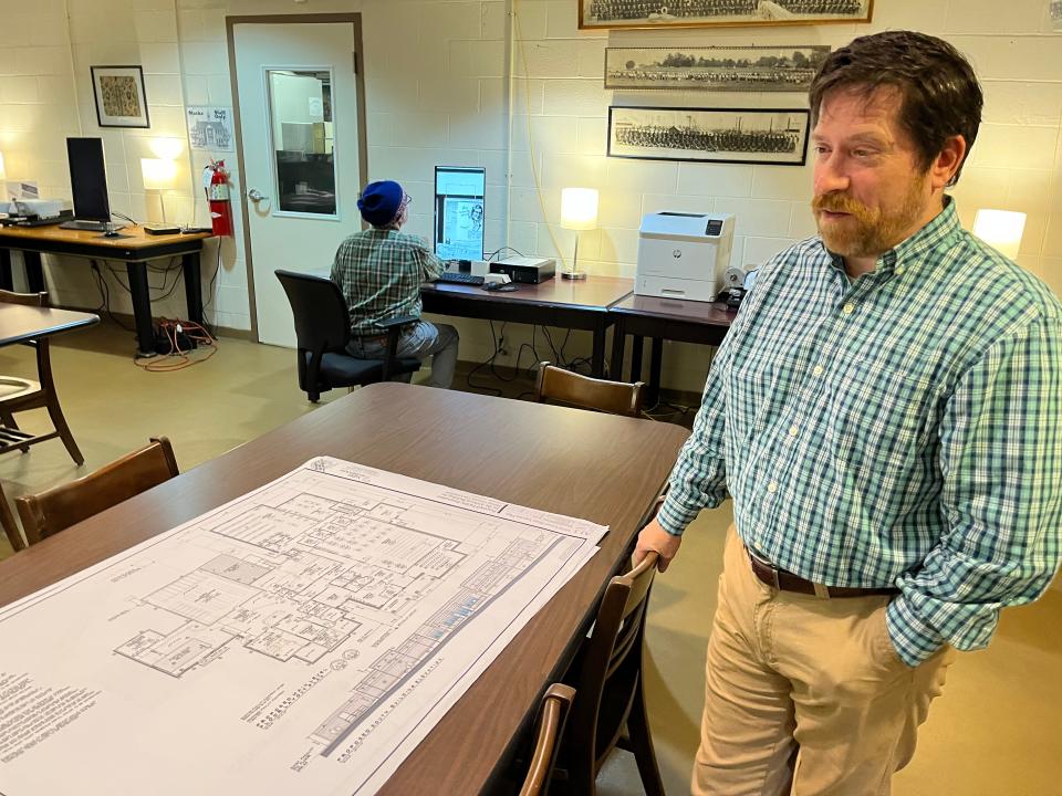 Maury County Archives Director Tom Price reviews plans for the building's expansion, increasing in space from approximately 2,000 square feet to almost 20,000 square feet, housing the county's historical documents, books, maps and other items.