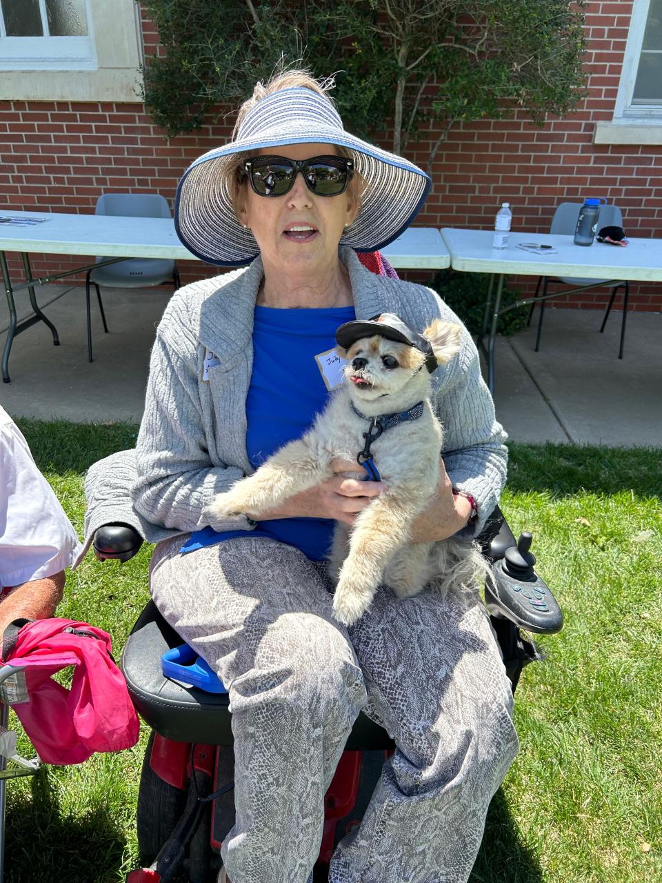 Judy Sharp poses with her dog Angelo, sporting a Harley Davidson cap, at the recent Westminster Doggy Show, held at Westminster Presbyterian Church by Austin Park. Sharp and Angelo actually tied for the Look-a-Like contest with Carlos Santes.